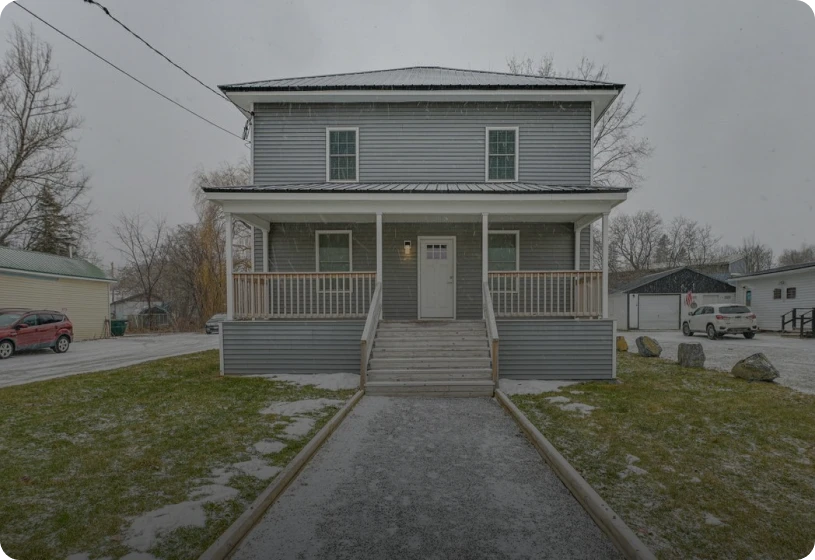 Two-story gray house with porch